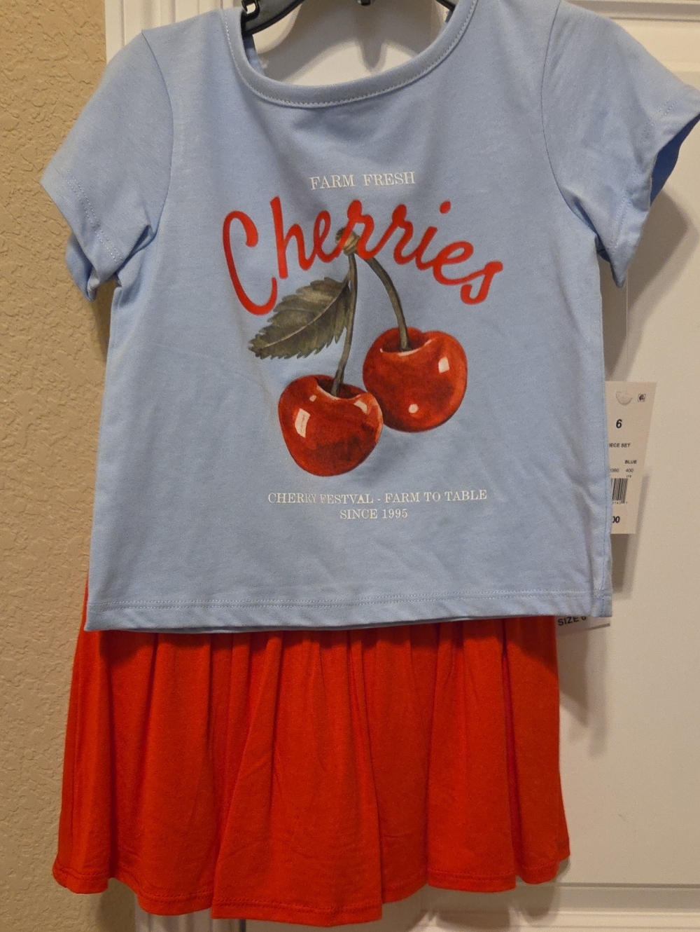 Girl's 2 Piece Light Blue Short-Sleeve Cherry Graphic Tee with Red Skirt